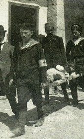 MSG073: Durrës: Austro-Hungarian sailors transporting a body on a stretcher, June 1914 (Marquis di San Giuliano Photo Collection).
