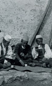 HAB22: “Young men in Gjonëm enjoying Turkish coffee” (Photo: Hugo Bernatzik, 1929).