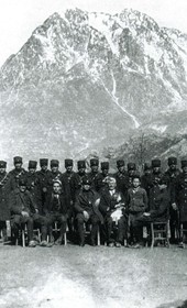 “Group picture of policemen (fronted by several civilians) in Northern Albania, shown against the background of a snow-covered mountain” (Photo: Carleton Coon 1929).